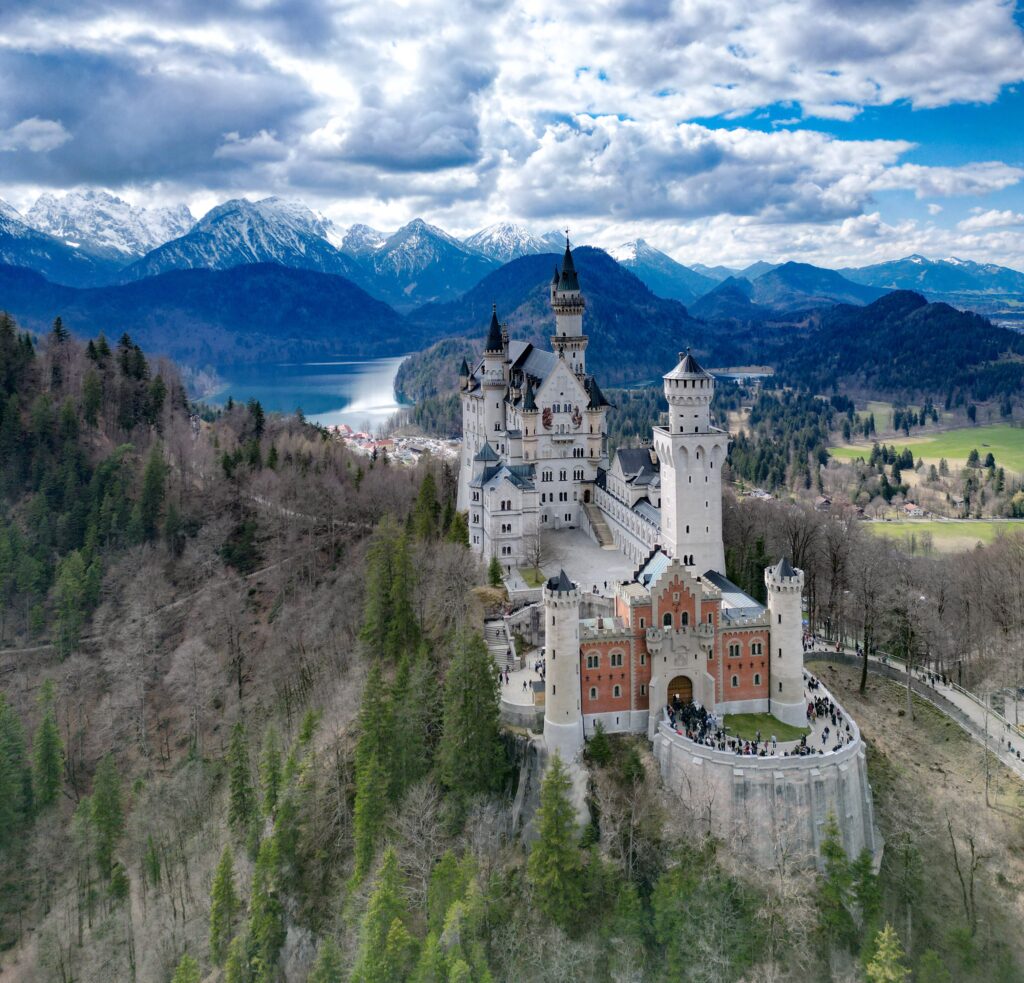 A view of Neuschwanstein Castle and the surrounding Bavarian Alps.